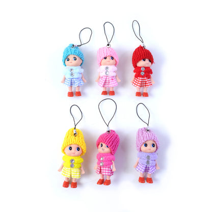 Six colorful Wukusy cute mini doll hanging keychains on a keyring, featuring playful designs and bright mixed colors.