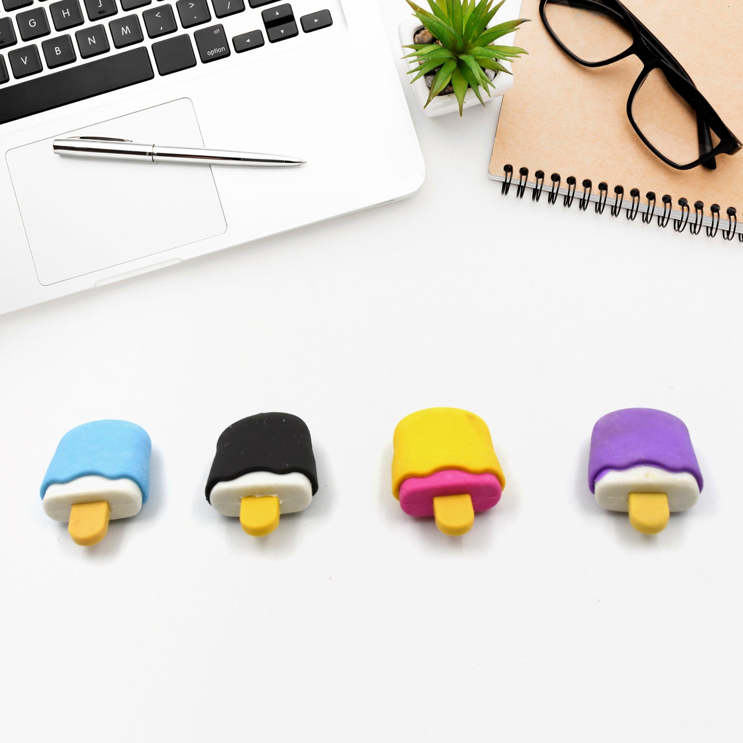 Set of four Wukusy ice cream-themed erasers shaped like doughnuts, lollipops, and ice cream cones for kids’ school supplies.