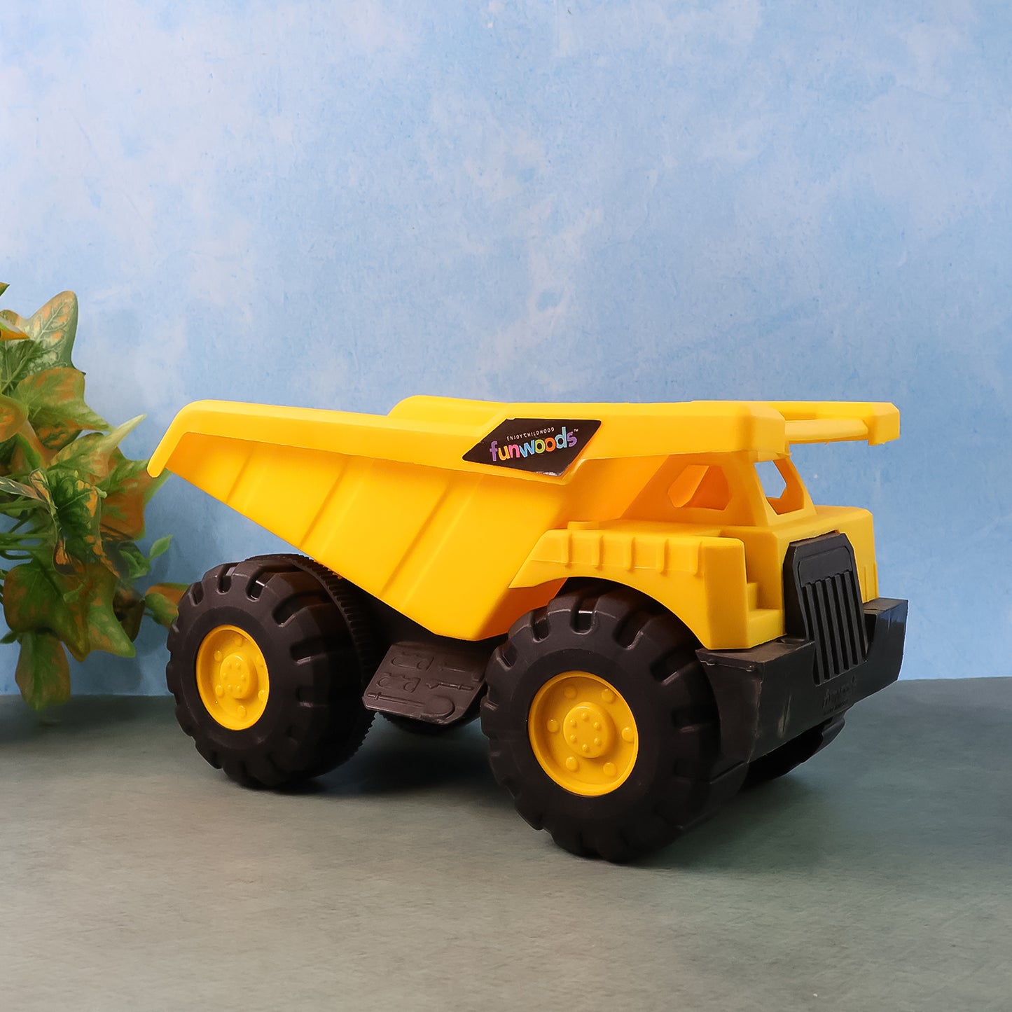 Wukusy Funwoods friction-powered dump truck toy with a red and yellow plastic body and black wheels, designed for children.