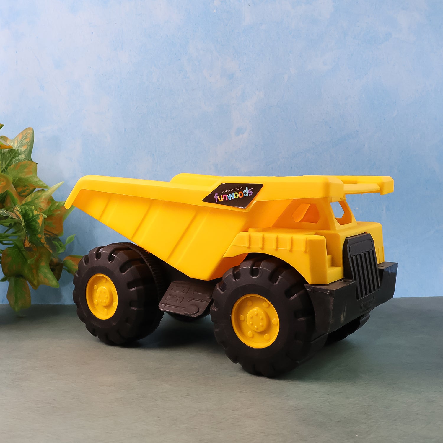Wukusy Funwoods friction-powered dump truck toy with a red and yellow plastic body and black wheels, designed for children.