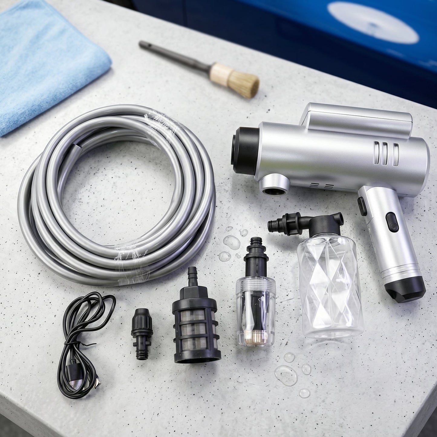 Wukusy cordless high pressure car washer gun kit with hose and foam attachment, portable cleaning tool for vehicle washing.