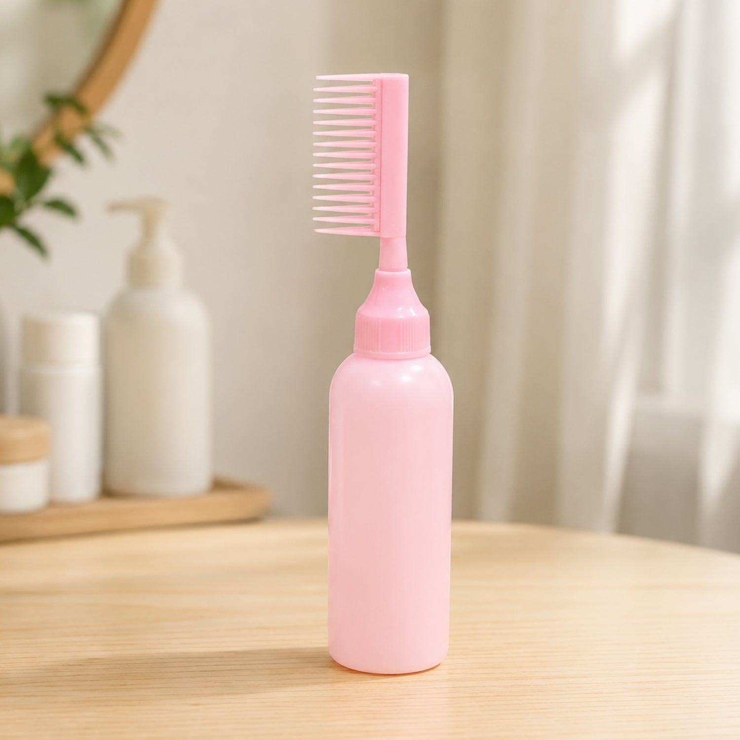 Wukusy 2-in-1 hair oil applicator bottle with scalp comb for root care, showing the transparent bottle and comb attachment.