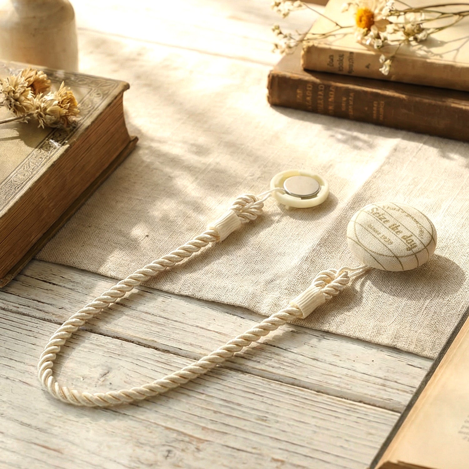 Elegant magnetic curtain tieback by Wukusy holding draped curtains with a sleek metallic finish.