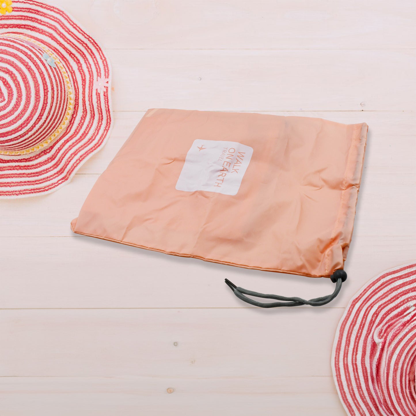Set of four waterproof nylon travel storage bags with drawstring closures, ideal for organizing clothes and shoes in luggage.