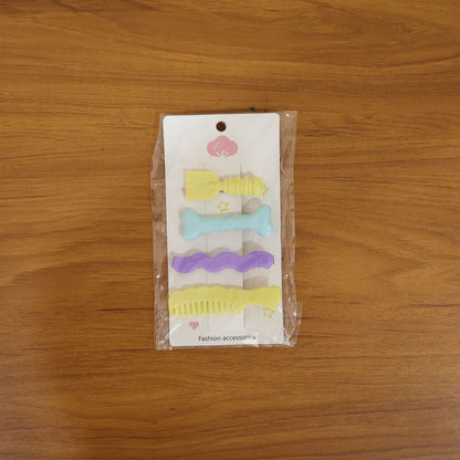 Set of four decorative alligator hair clips for girls and women by Wukusy, featuring cute styling pins in colorful designs.