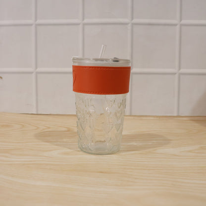 Transparent glass drinking tumbler with lid by Wukusy, ideal for water or juice, shown with a clear view of the glass and lid.