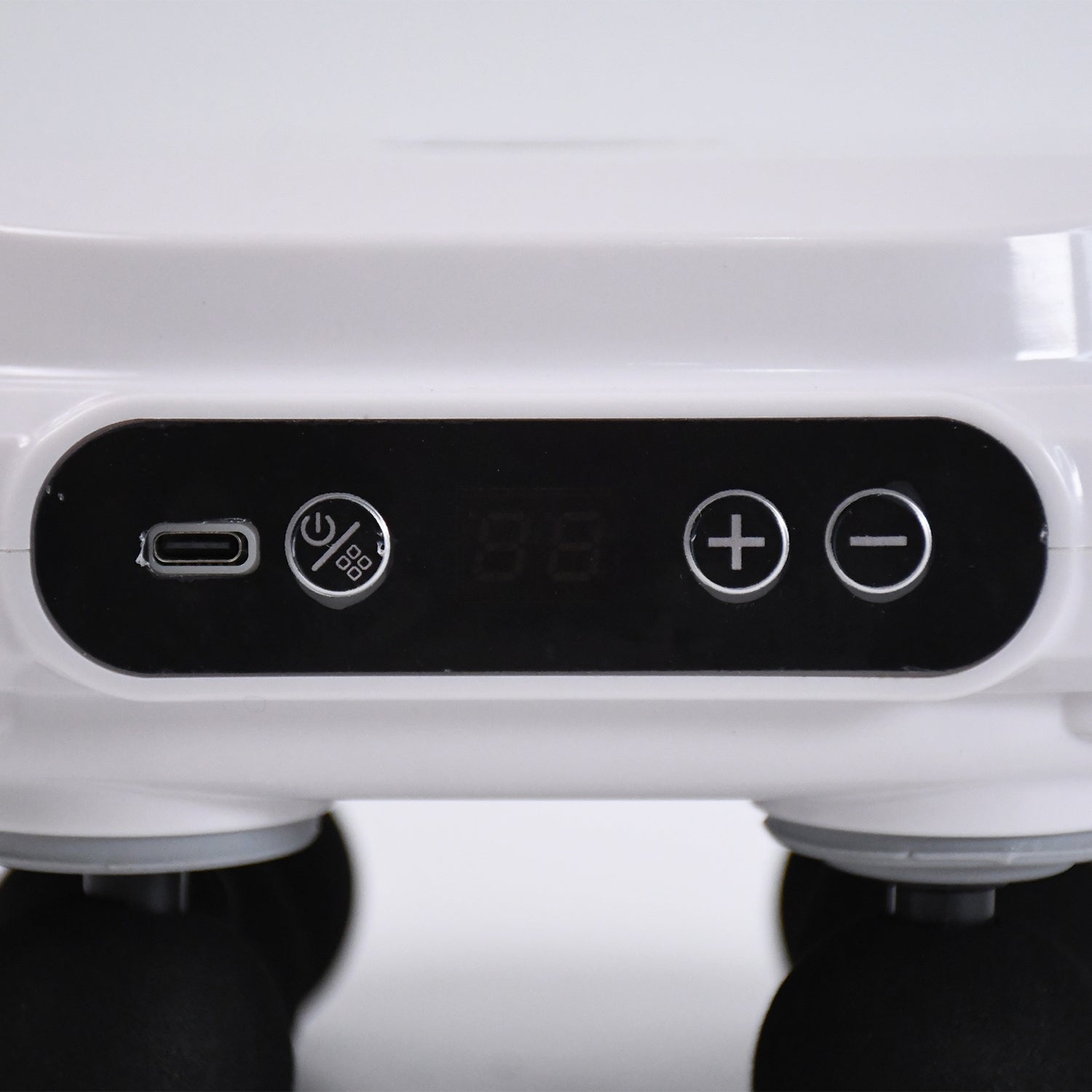 Wukusy 4-heads massage gun for pain relief with multiple attachment heads, handheld device for muscle relaxation and recovery.