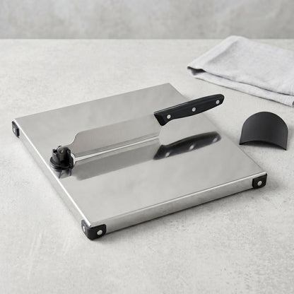 Wukusy stainless steel 2-in-1 cutting and chopping board with built-in knife, shown with the board and knife ready for food prep