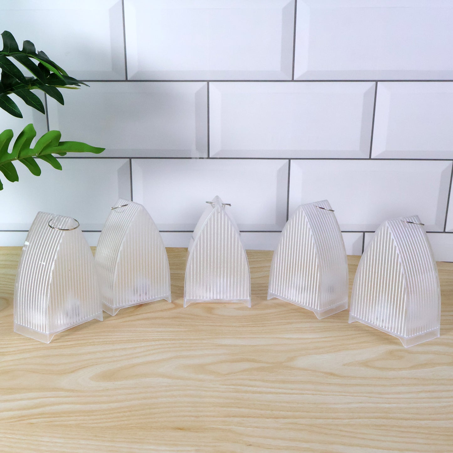 Set of five Wukusy LED flameless decorative lantern lights for home decor, with warm glowing illuminated lanterns.