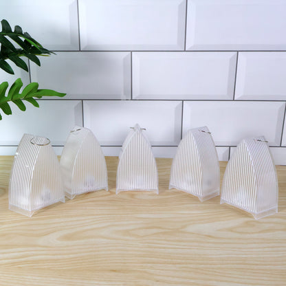 Set of five Wukusy LED flameless decorative lantern lights for home decor, with warm glowing illuminated lanterns.
