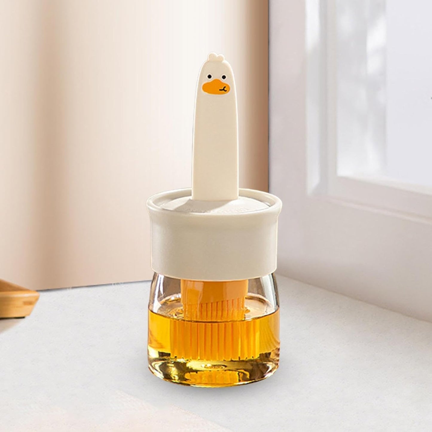 Wukusy 2-in-1 oil dispenser bottle with dual spouts, transparent plastic container for cooking oils and dressings.