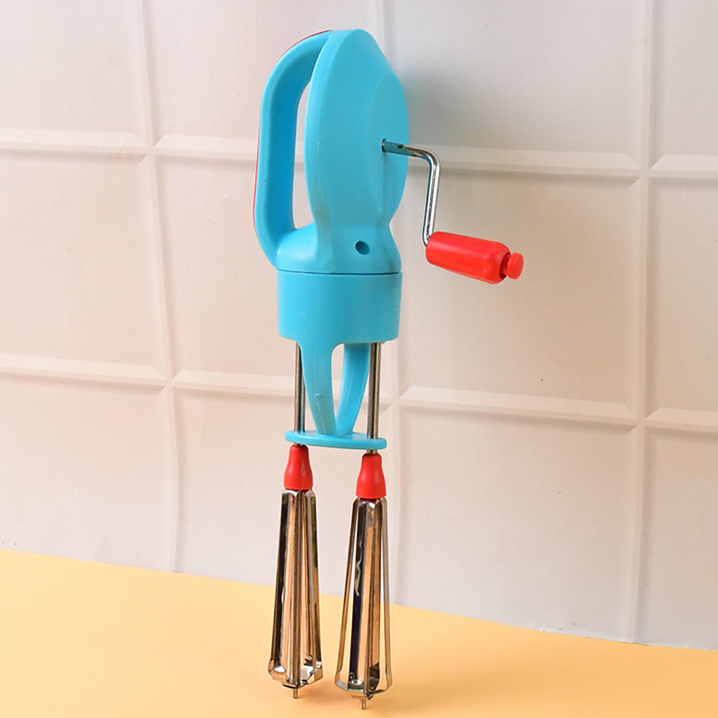 Wukusy Supermom high-speed manual hand beater with dual stainless steel whisks for mixing and whipping in the kitchen.