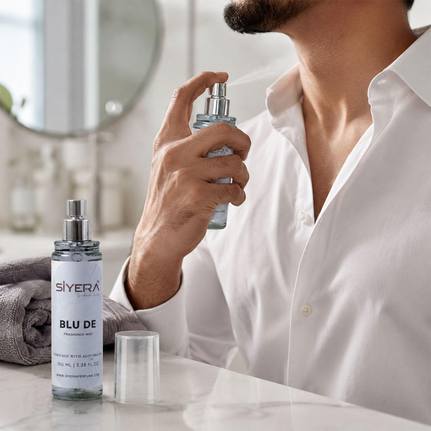 Wukusy Blu De fragrance mist spray bottle with aloe vera gel, 100 ml, featuring a sleek design and vibrant blue accents.