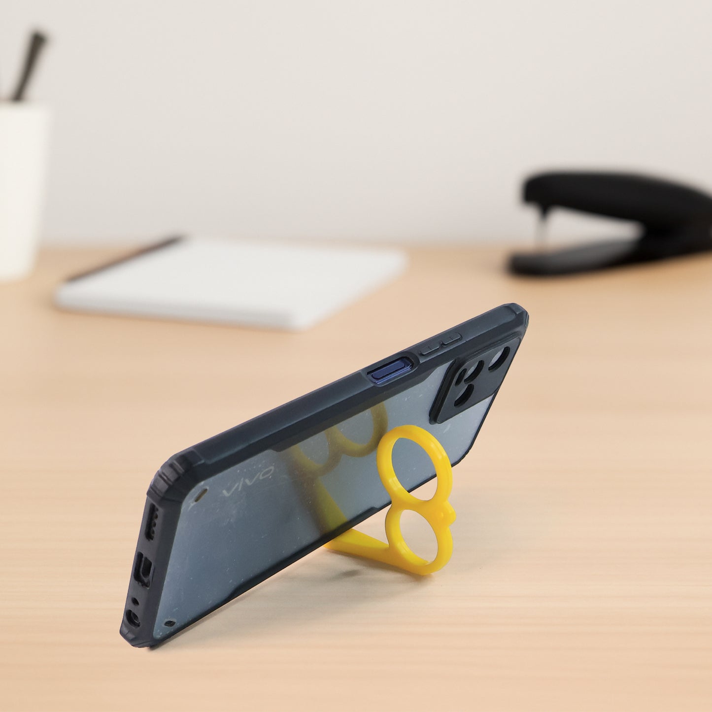 Set of 50 colorful Wukusy plastic hand mobile stands for office use, featuring versatile grip design for holding smartphones.