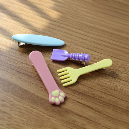 Set of four Wukusy cute multi-design hair clips featuring colorful and playful styles for everyday hair accessories.