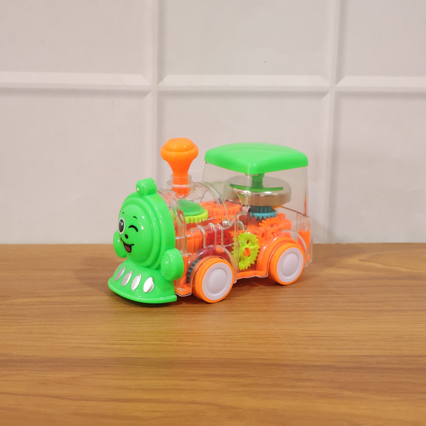 Kids Wukusy musical light-up transparent train toy with colorful lights and moving parts, designed for young children.