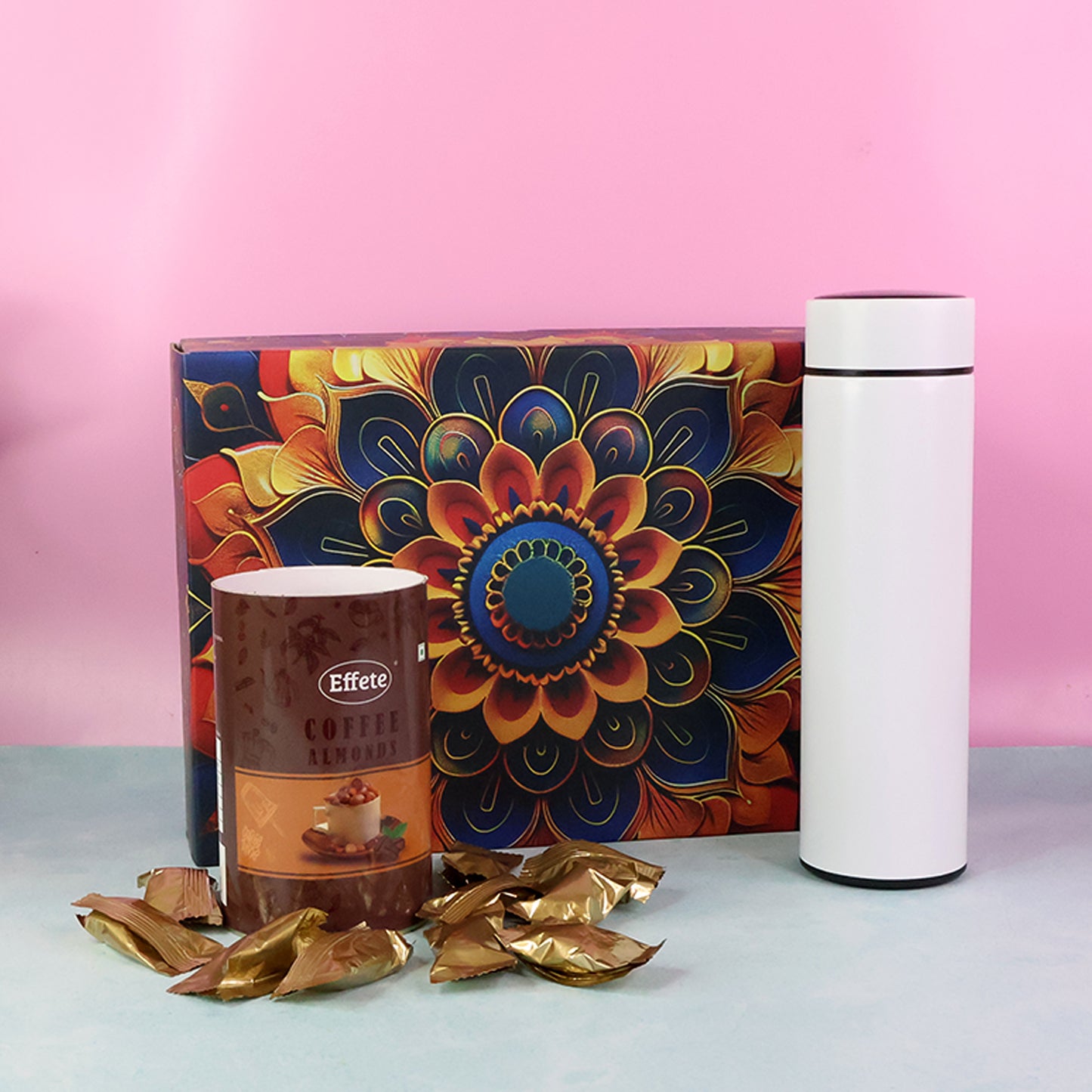 Wukusy Effete Coffee Almonds Gift Hamper with golden packaging and a bottle, ideal for home and kitchen gifts.