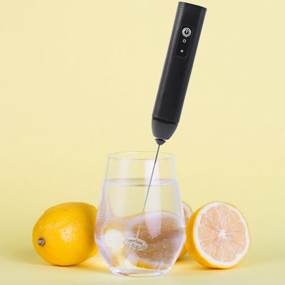 Wukusy small electric handheld milk frother with stainless steel whisk for home coffee and beverage frothing.