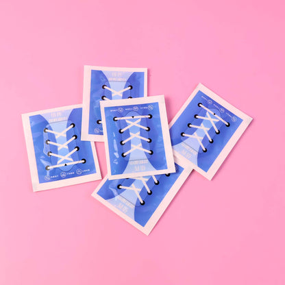 Wukusy premium shoe cleaning wipes in a 30-pack, shown with open pack and wipes ready for use on footwear.