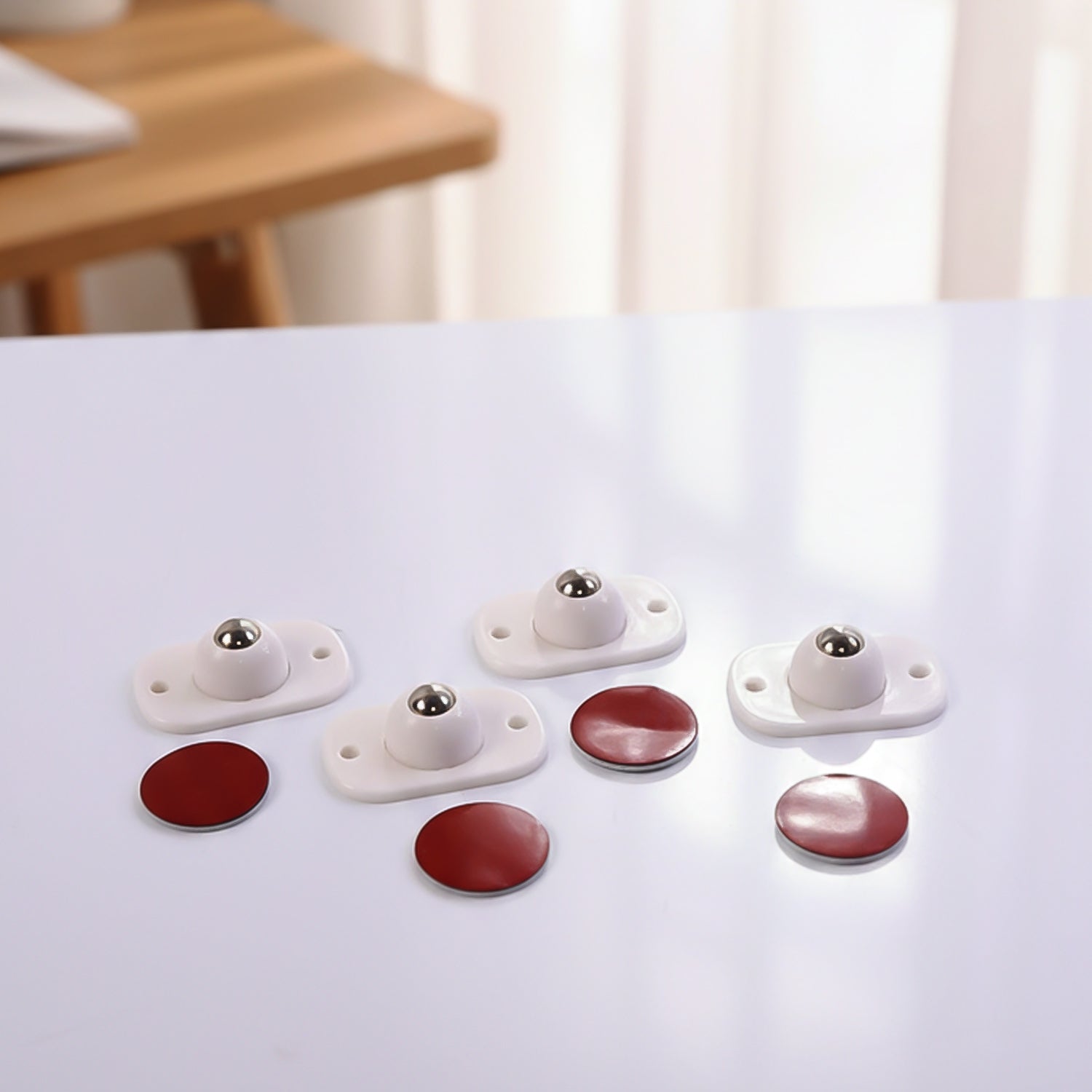 Set of four Wukusy heavy-duty furniture moving roller mini wheels for easy furniture relocation and smooth movement.