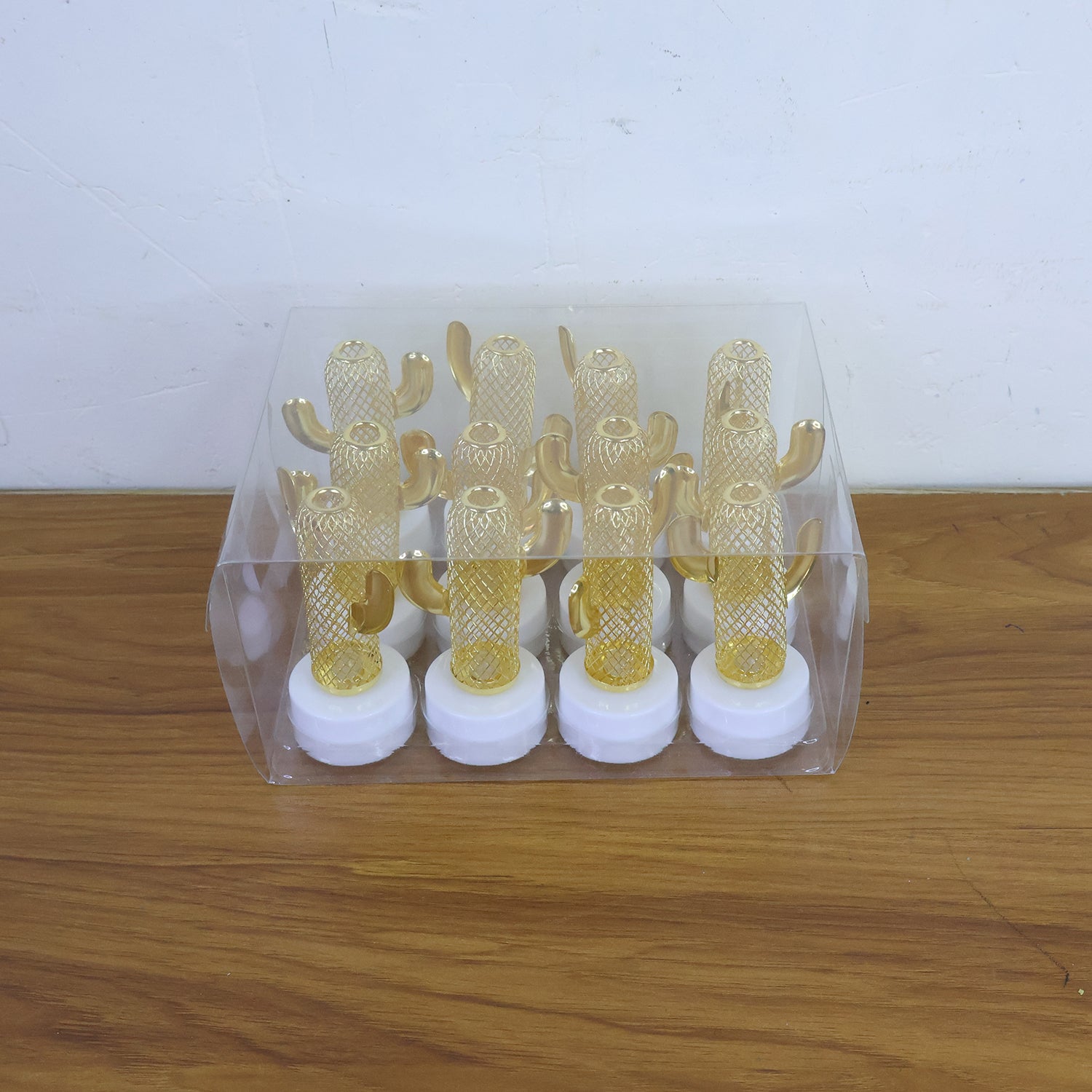 Set of 12 Wukusy decorative cactus-shaped flameless LED candles for home decor, featuring cactus designs in a natural setting.