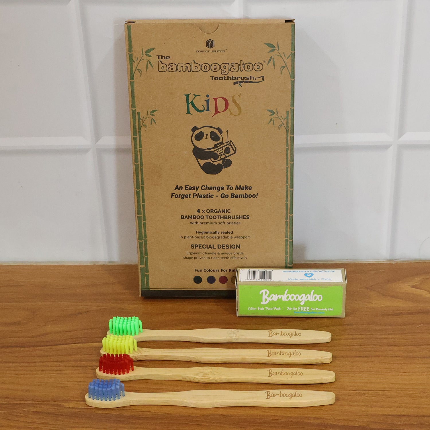 Wukusy bamboo toothbrush set for adults with four eco-friendly toothbrushes featuring natural bamboo handles and soft bristles.