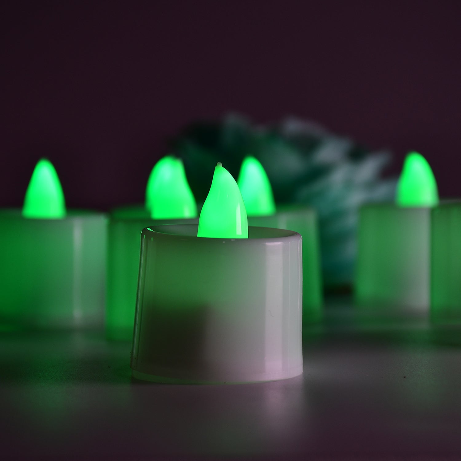 Wukusy green flameless LED tealights in plastic cups, smokeless, decorative candles for home décor, pack of 24.