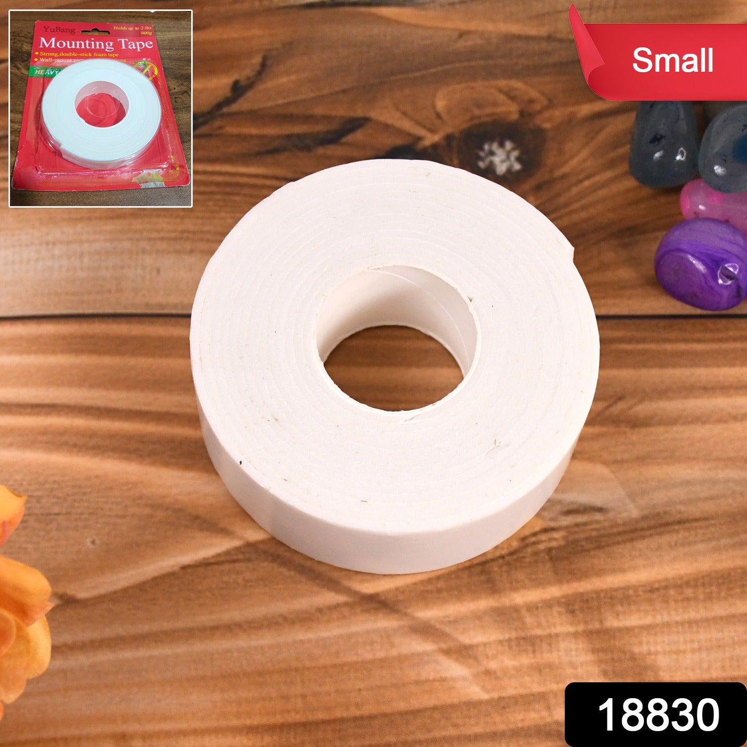 Small Wukusy double-sided foam mounting tape for office use, shown in a close-up image of the tape roll and application surface.