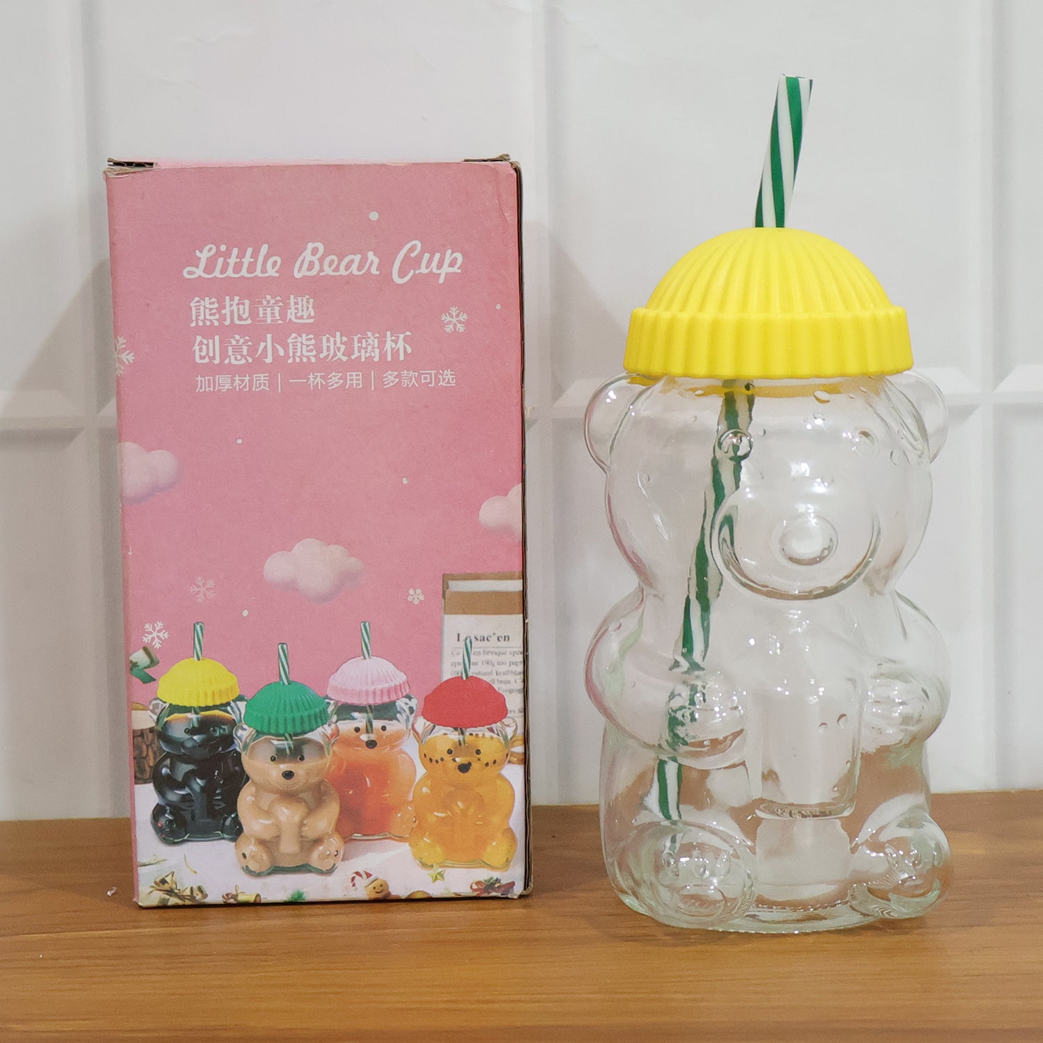 Wukusy glass bear-shaped kids drinking cup with straw, 350ml, featuring a cute bear design and colorful lid for children.