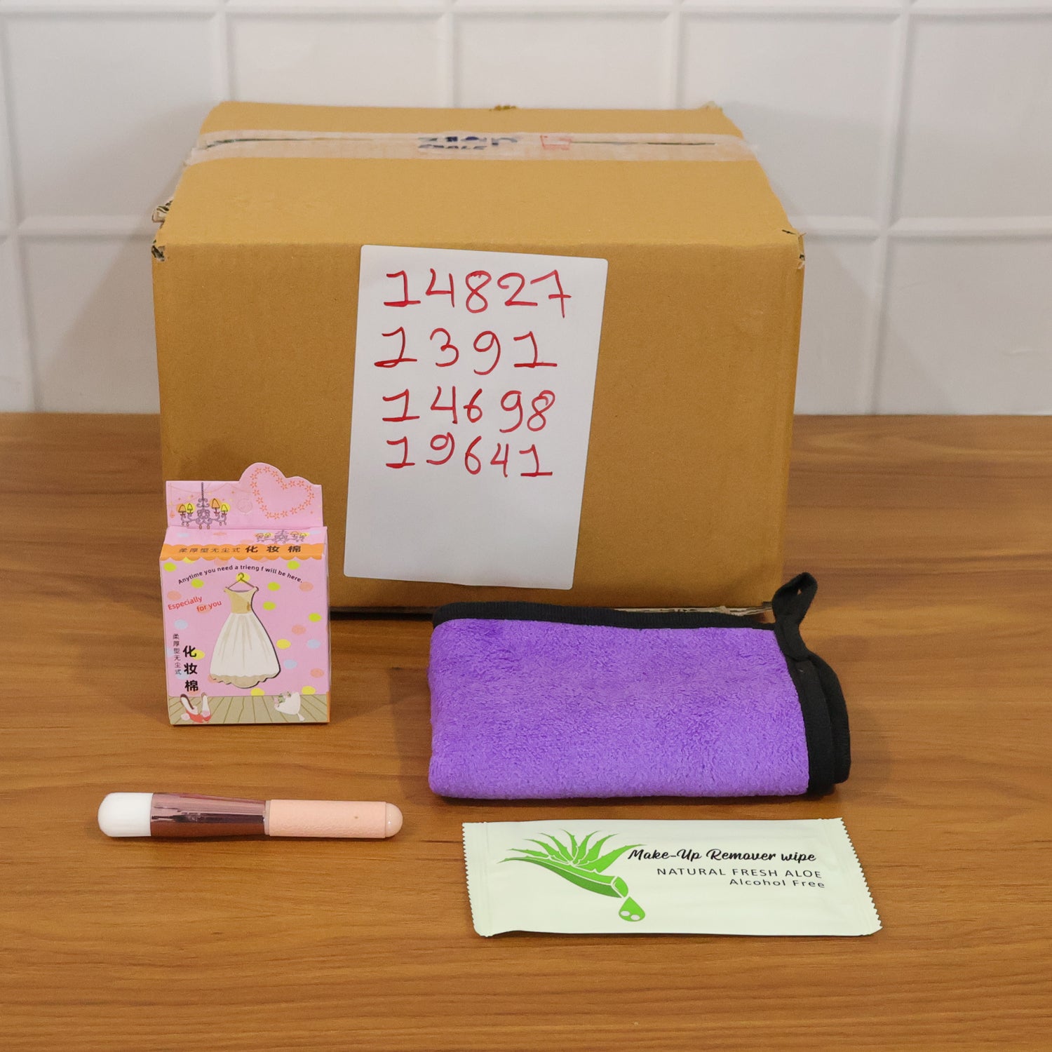 Wukusy 4-in-1 beauty care essentials gift set with skincare, facial tools, and grooming products arranged in a gift box.