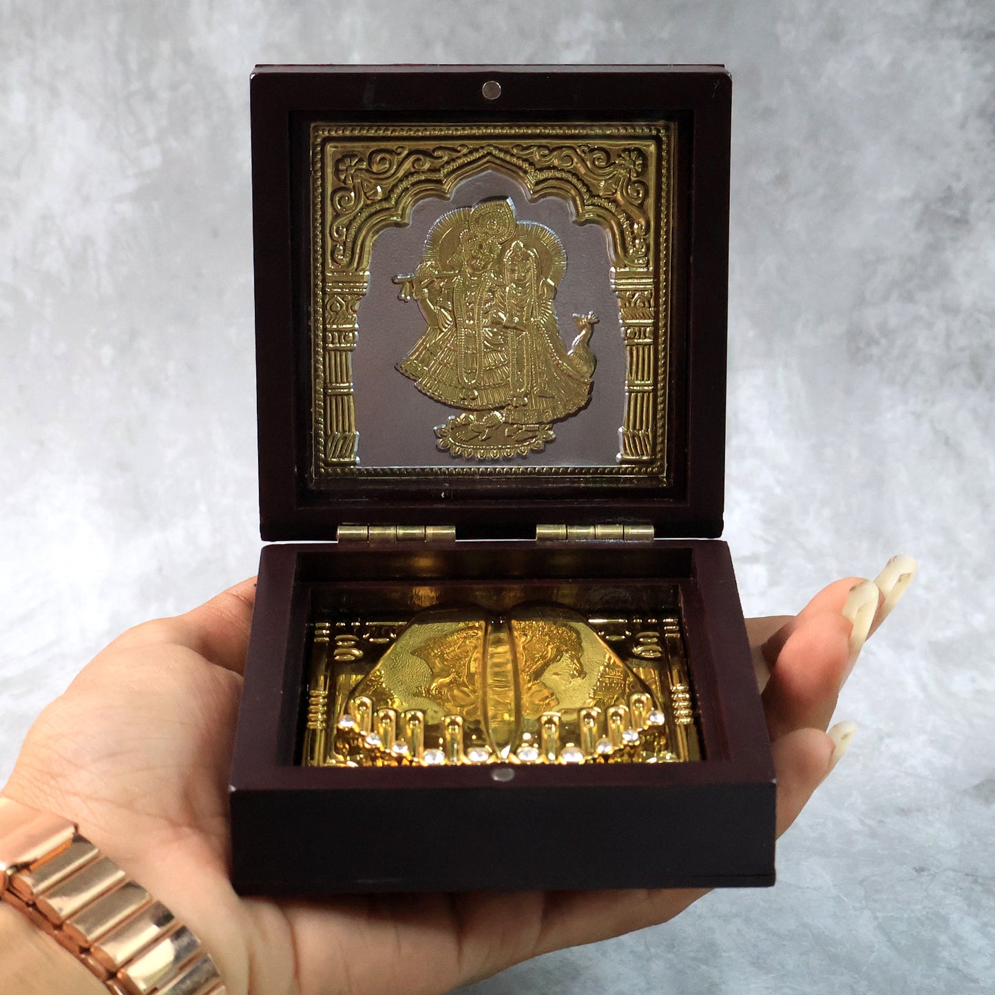 Golden Charan Paduka in wooden box, a spiritual home decor accessory by Wukusy, used for Pooja and religious rituals.