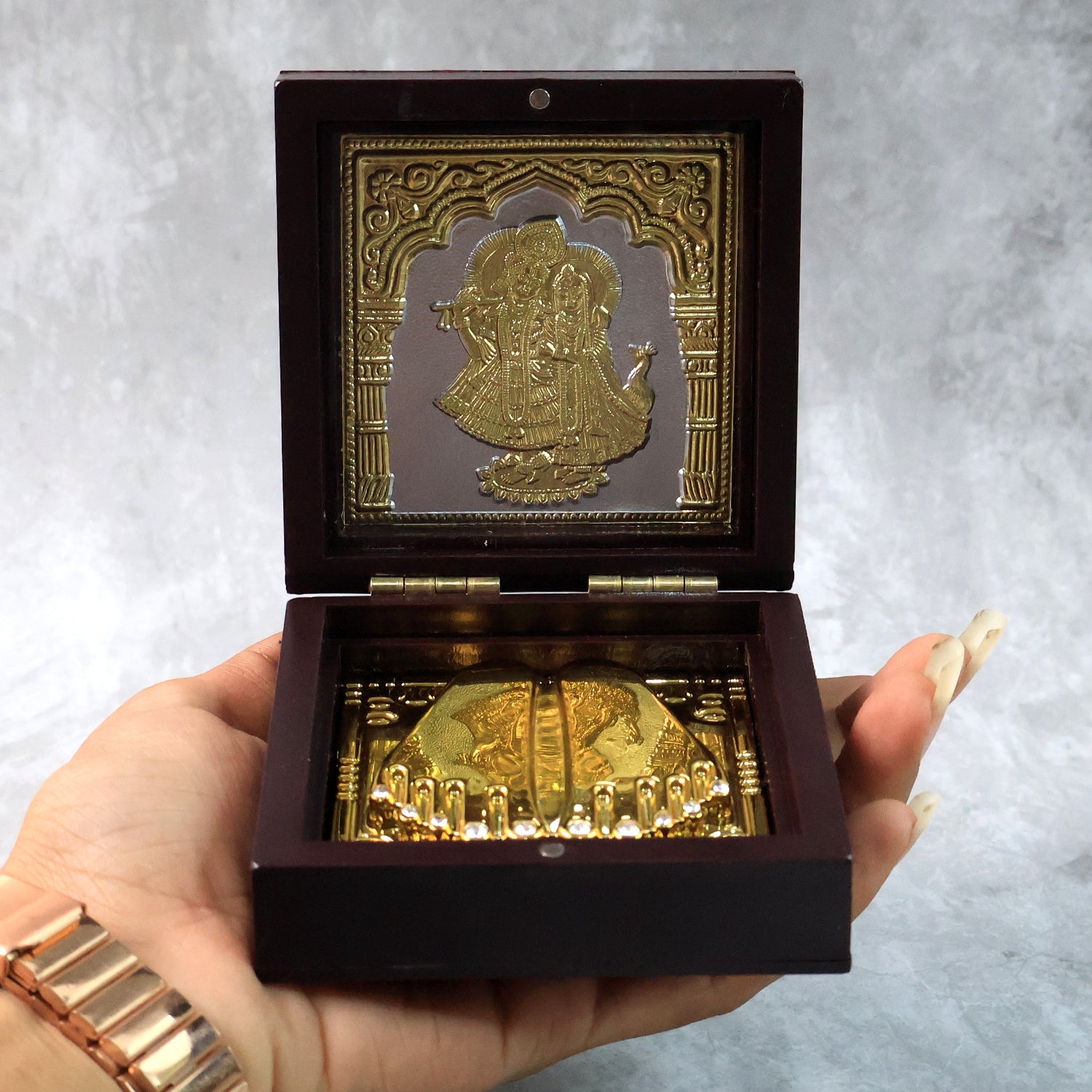 Golden Charan Paduka in wooden box, a spiritual home decor accessory by Wukusy, used for Pooja and religious rituals.