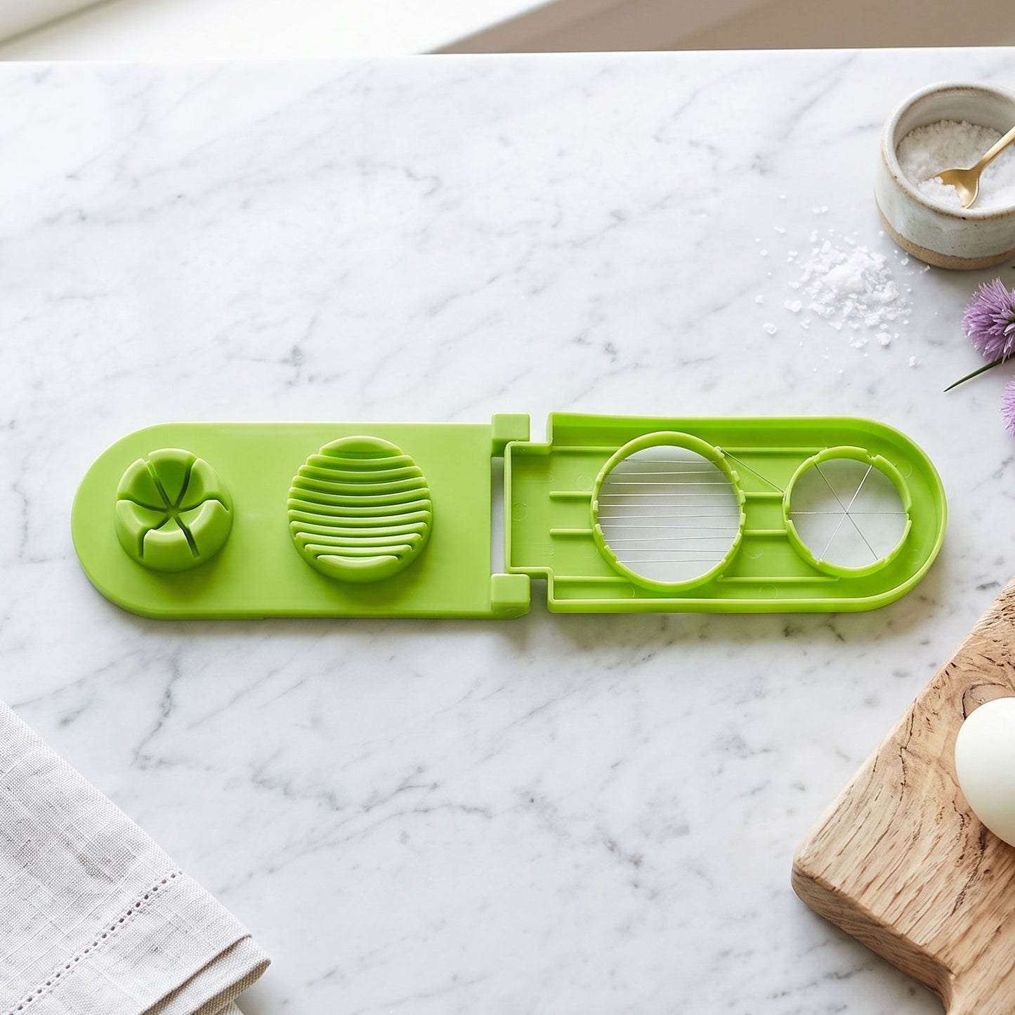 Wukusy 2-in-1 egg slicer and wedger with stainless steel wire, used for neatly slicing and wedging boiled eggs.