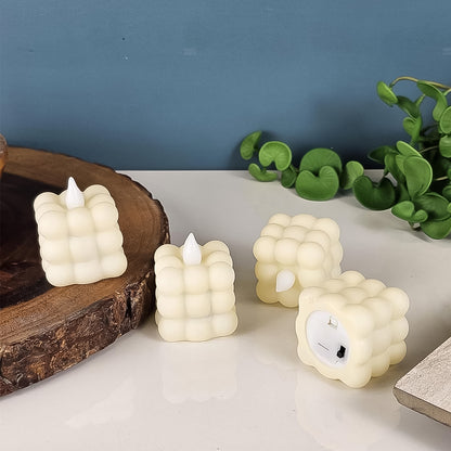 Set of 24 Wukusy LED flameless cube decorative candles for home decor, realistic flickering light, safe and stylish ambiance.