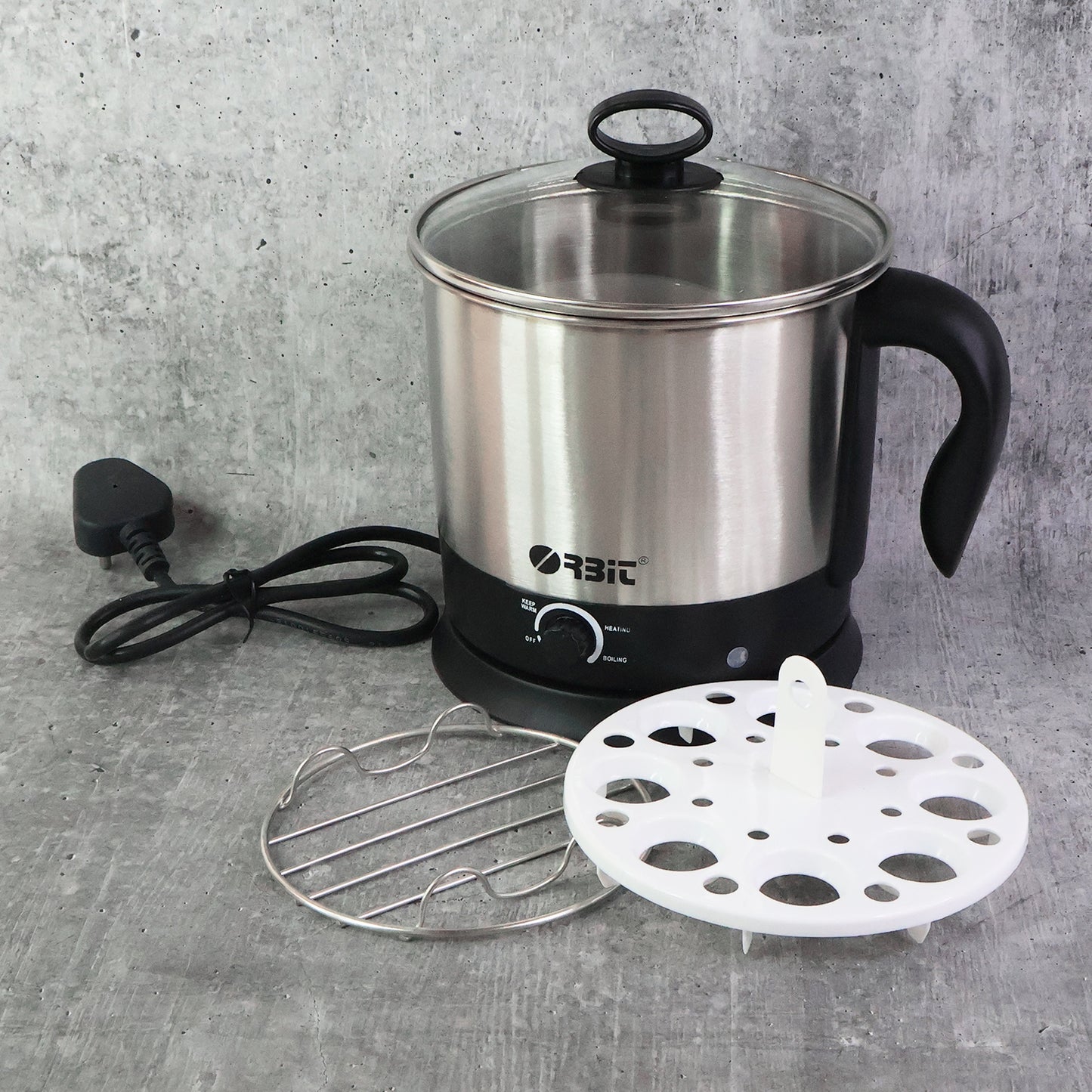 Wukusy Orbit Electric Idli Cooker and Steamer with 650W power, stainless steel trays, and digital controls for home kitchen use.