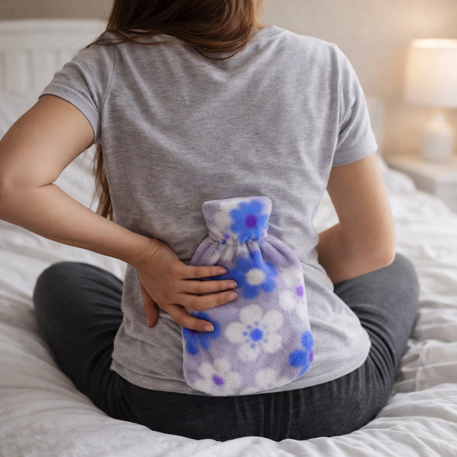 Wukusy floral printed soft plush hot water bag with cover, measuring 19x12 cm, featuring colorful floral design and cozy fabric cover.