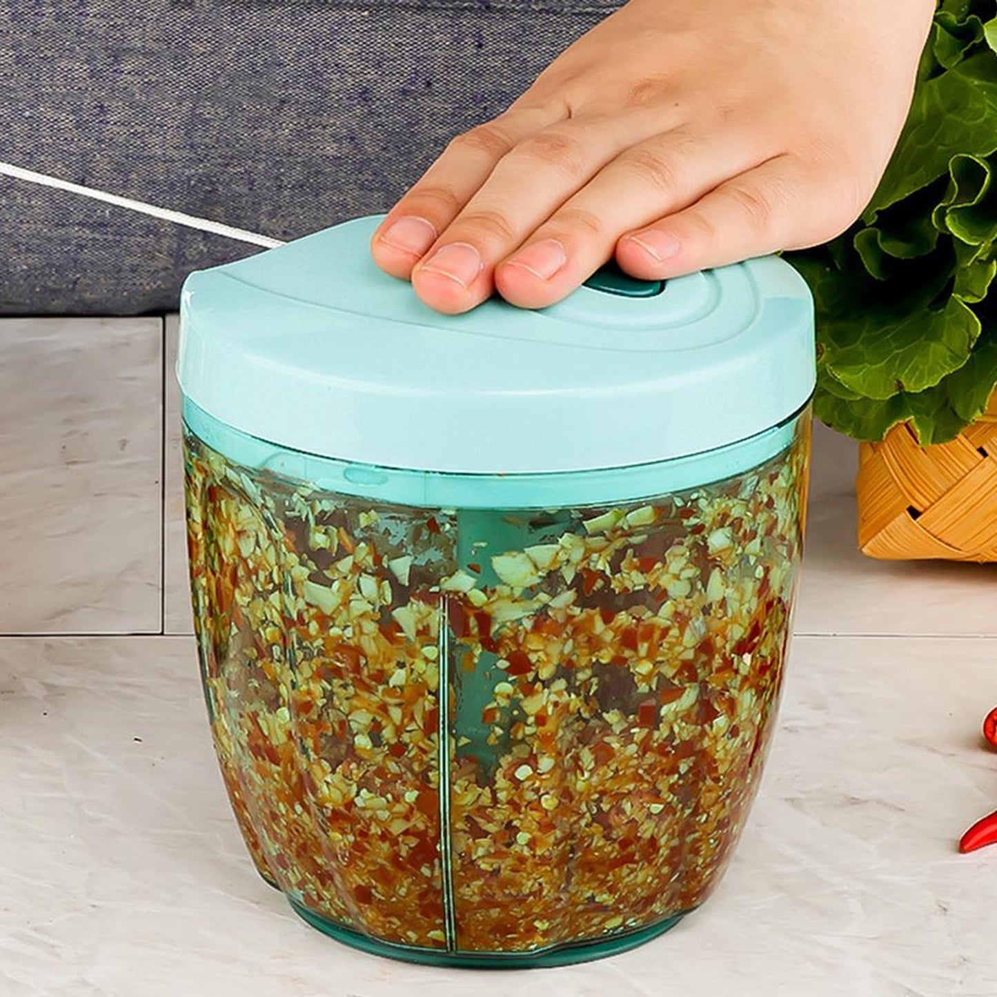 Wukusy manual stainless steel vegetable chopper with 5 blades, compact hand-held kitchen tool for slicing and chopping vegetables.