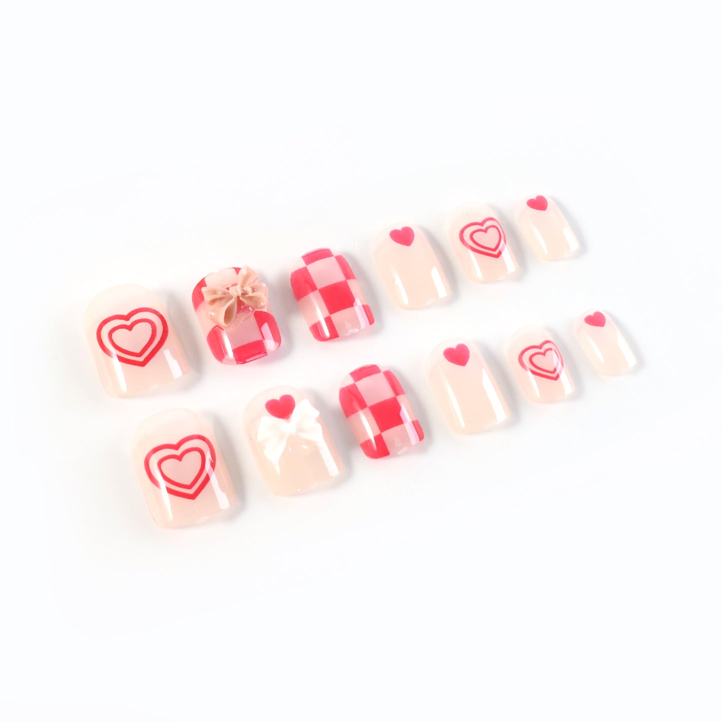 Set of Wukusy premium artificial false nails with mixed designs, featuring various stylish nail art and finishes.