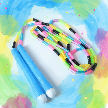 Wukusy skipping rope for fitness workout, showing a close-up of the red and black jump rope coiled on a white background