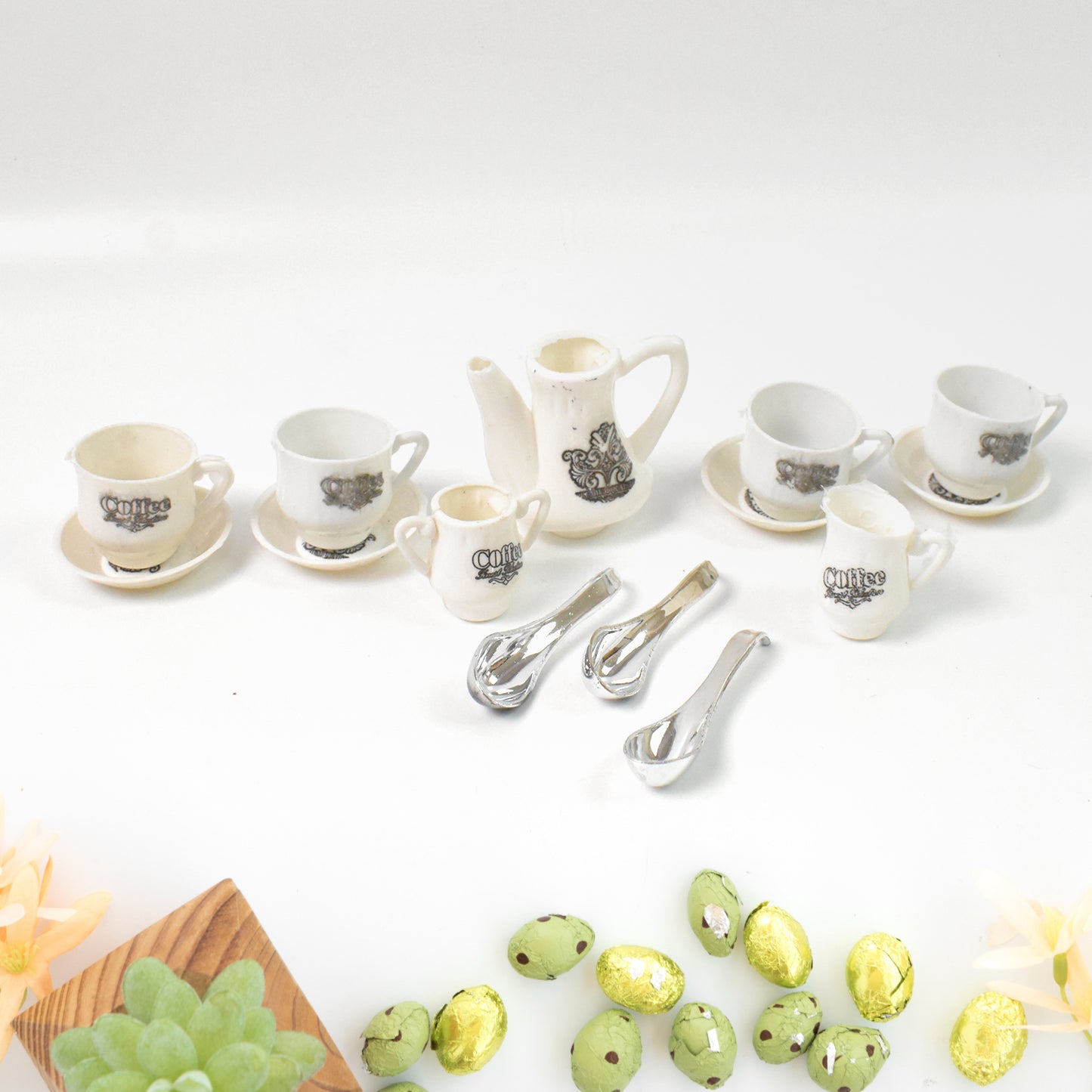 Wukusy Tickles Tea Toy Set with 14 plastic coffee kitchen accessories for kids, boys, and girls, arranged on a wooden surface.
