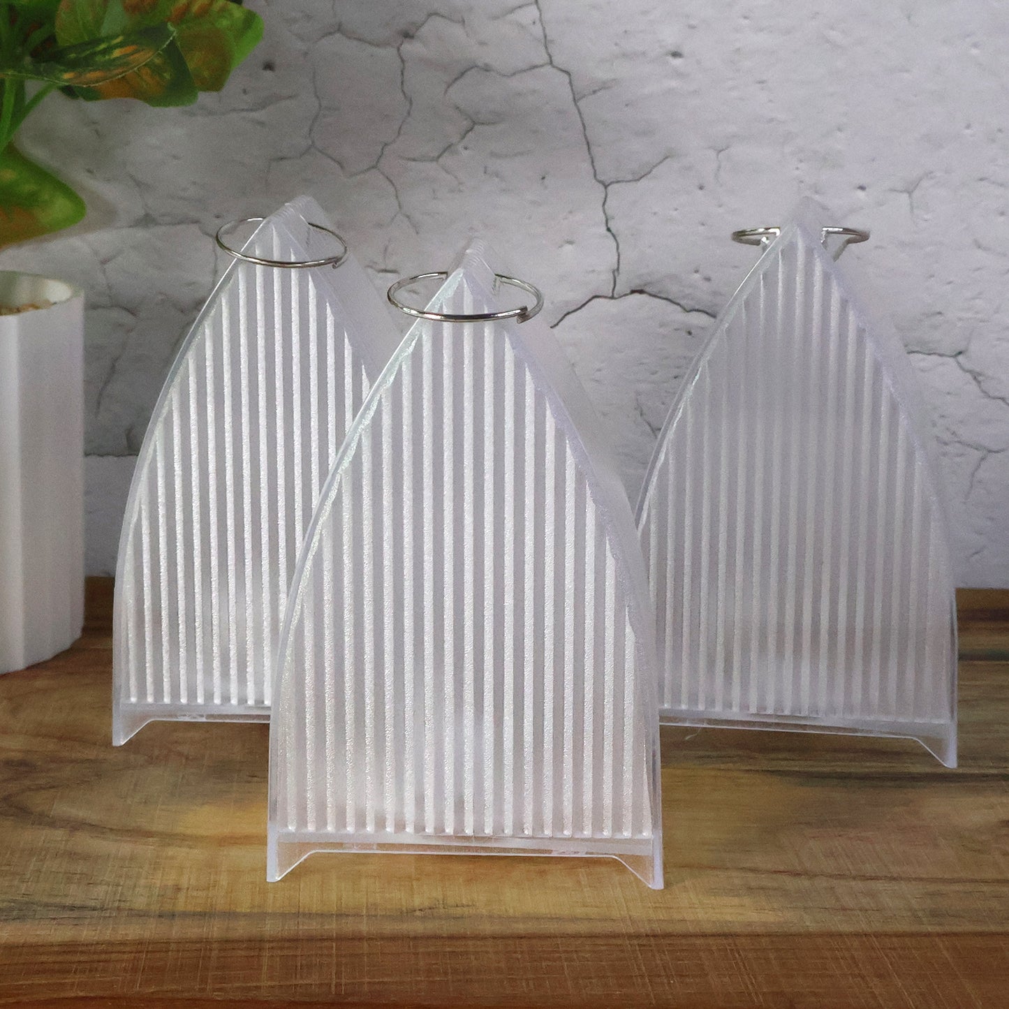 Three Wukusy flameless LED decorative lanterns for home decor, featuring warm glow and intricate designs.