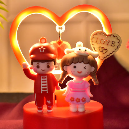 Cute romantic couple love showpiece with heart frame, decorative home decor figurine by Wukusy, featuring a loving couple in a tender pose