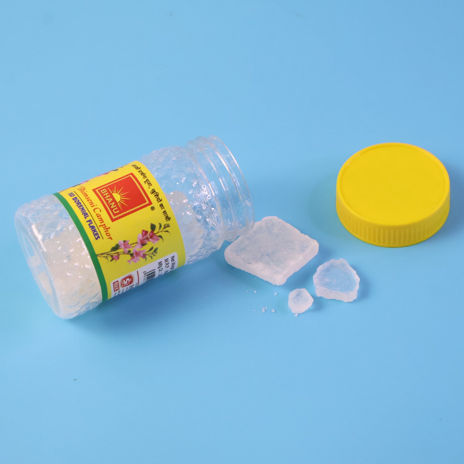 Premium Wukusy Bhimseni Camphor flakes in a 20g package, showing clear, white camphor crystals in a transparent container.