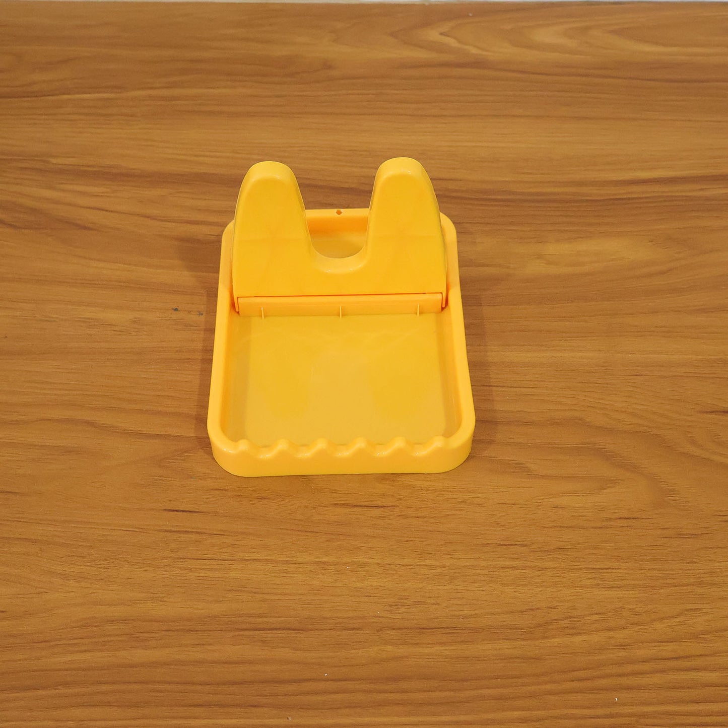 Wukusy multipurpose kitchen lid and spoon holder stand on countertop, black plastic design, keeps lids and utensils organized.