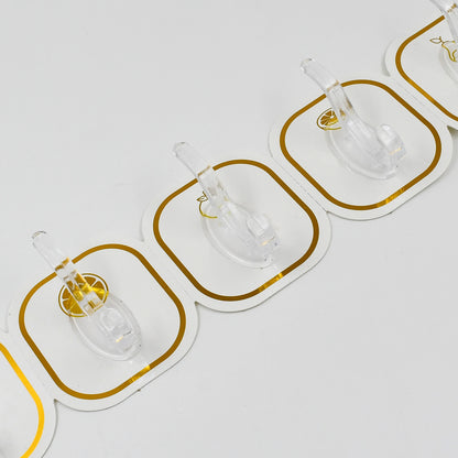 Six transparent Wukusy adhesive wall hooks attached to a wall for home organization and hanging items.