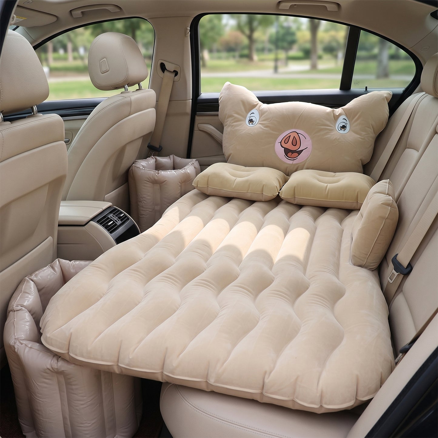 Wukusy cartoon pig design car air mattress bed set with pillows, inflatable travel bed for kids, shown inflated with pillows.