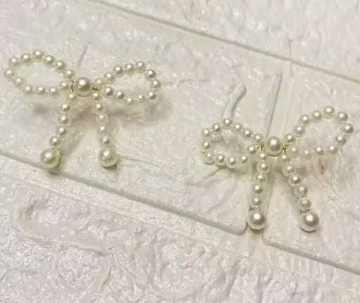 Ekom Pearl Knot Bow Dangle Earrings with elegant pearl and bow design, fashion jewelry for stylish occasions.