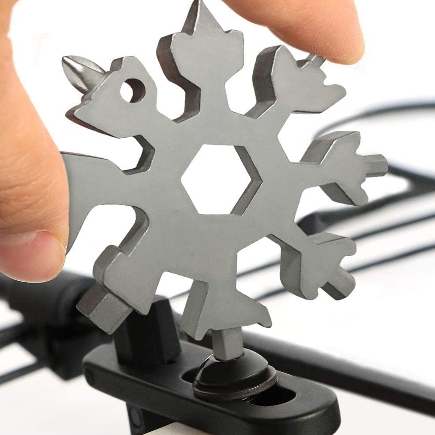 Wukusy 1787 Snowflake multi-tool stainless steel bottle opener with snowflake design, compact hardware accessory for opening bottles.