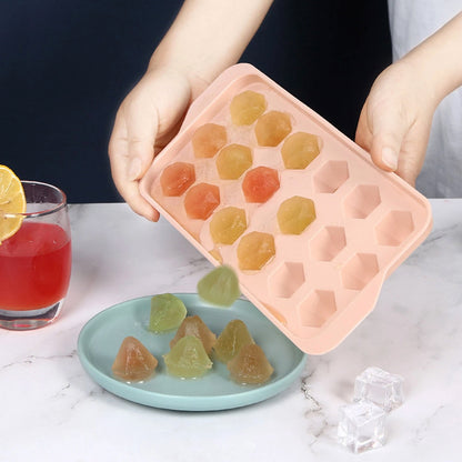 Wukusy durable plastic ice cube tray for home kitchen, showing multiple ice cubes in a clear tray on a countertop.
