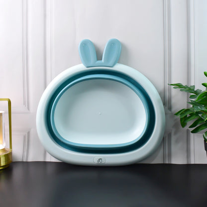 Foldable collapsible basin with bunny ear handles, ideal for baby care, by Wukusy, shown with the basin unfolded and handles visible.